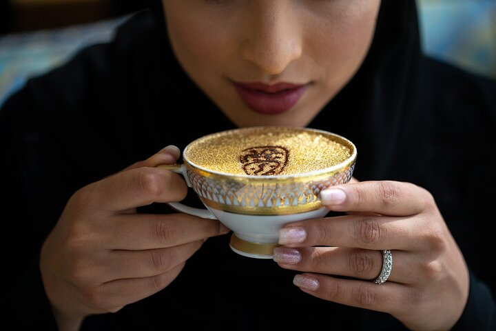 Savor the luxurious Signature Gold Cappuccino featuring real 24-carat gold flakes while taking in stunning views from the Skyview Bar at the iconic Burj Al Arab.
